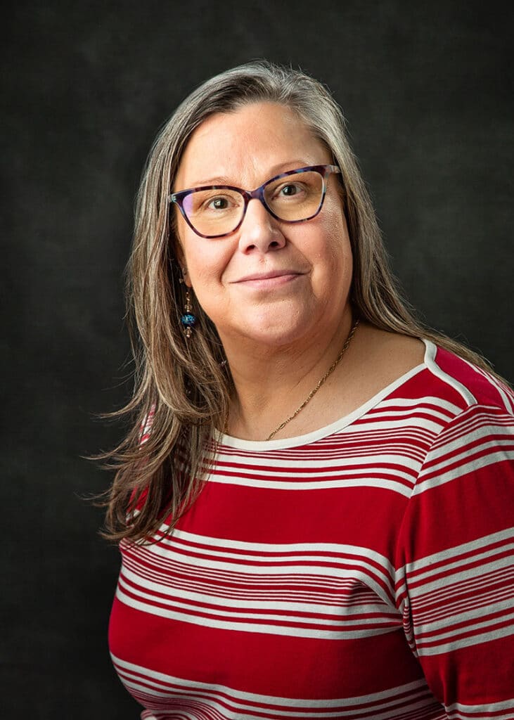 Woman with red and white shirt with glasses